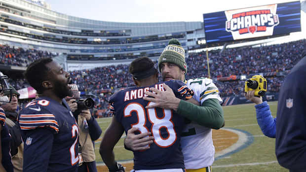 Safety Adrian Amos and quarterback Aaron Rodgers embrace following a 2018 regular season game